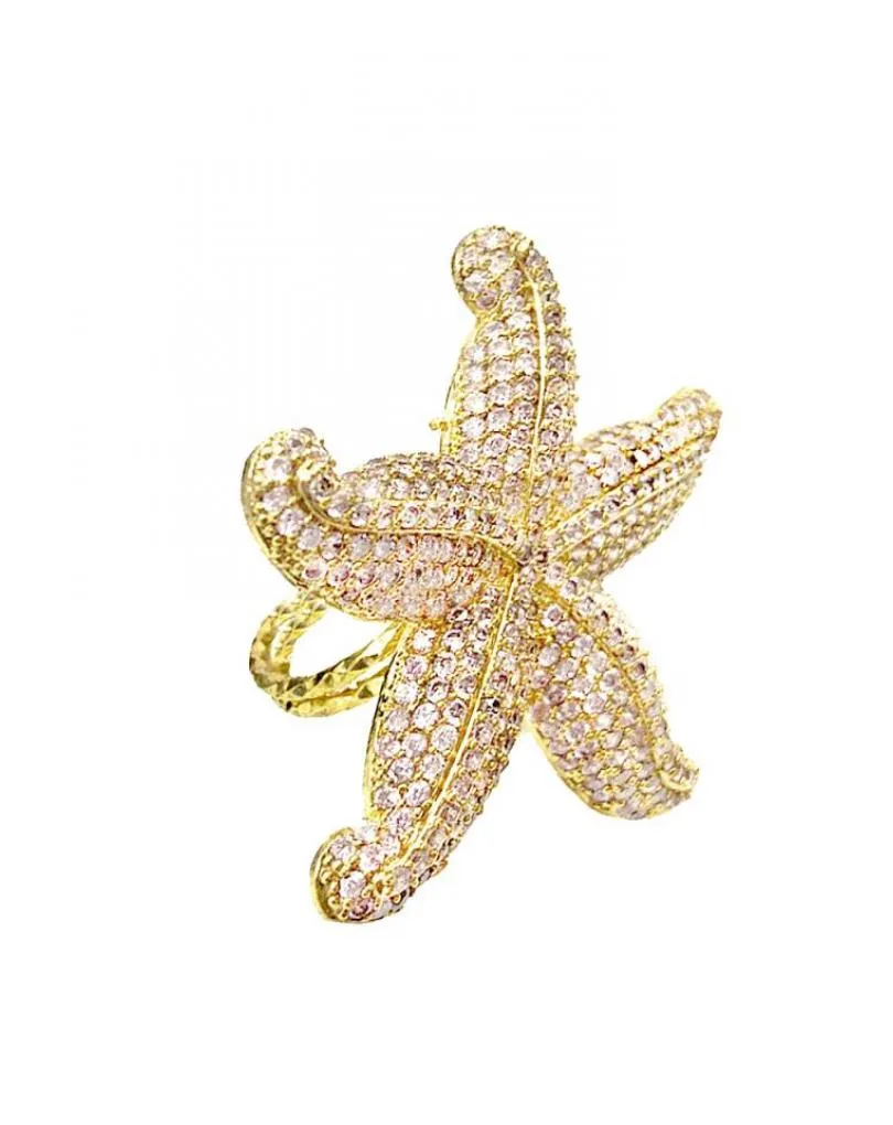 ANILLOS ROSAS DE ESTRELLA DE MAR DECORADA CON PEDRERIA