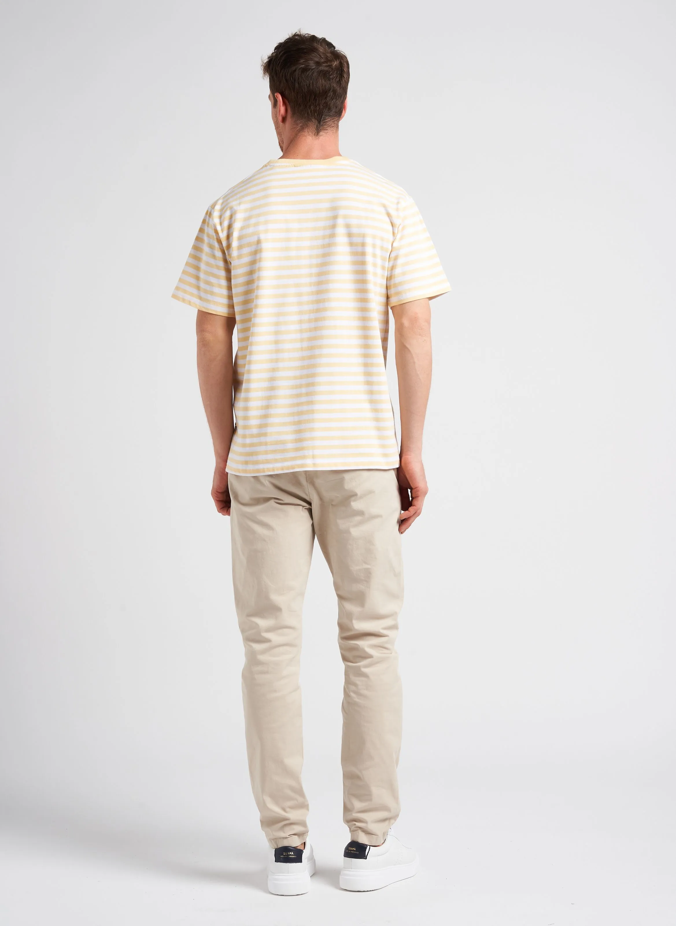 Pantalón chino regular fit de algodón elástico en beige