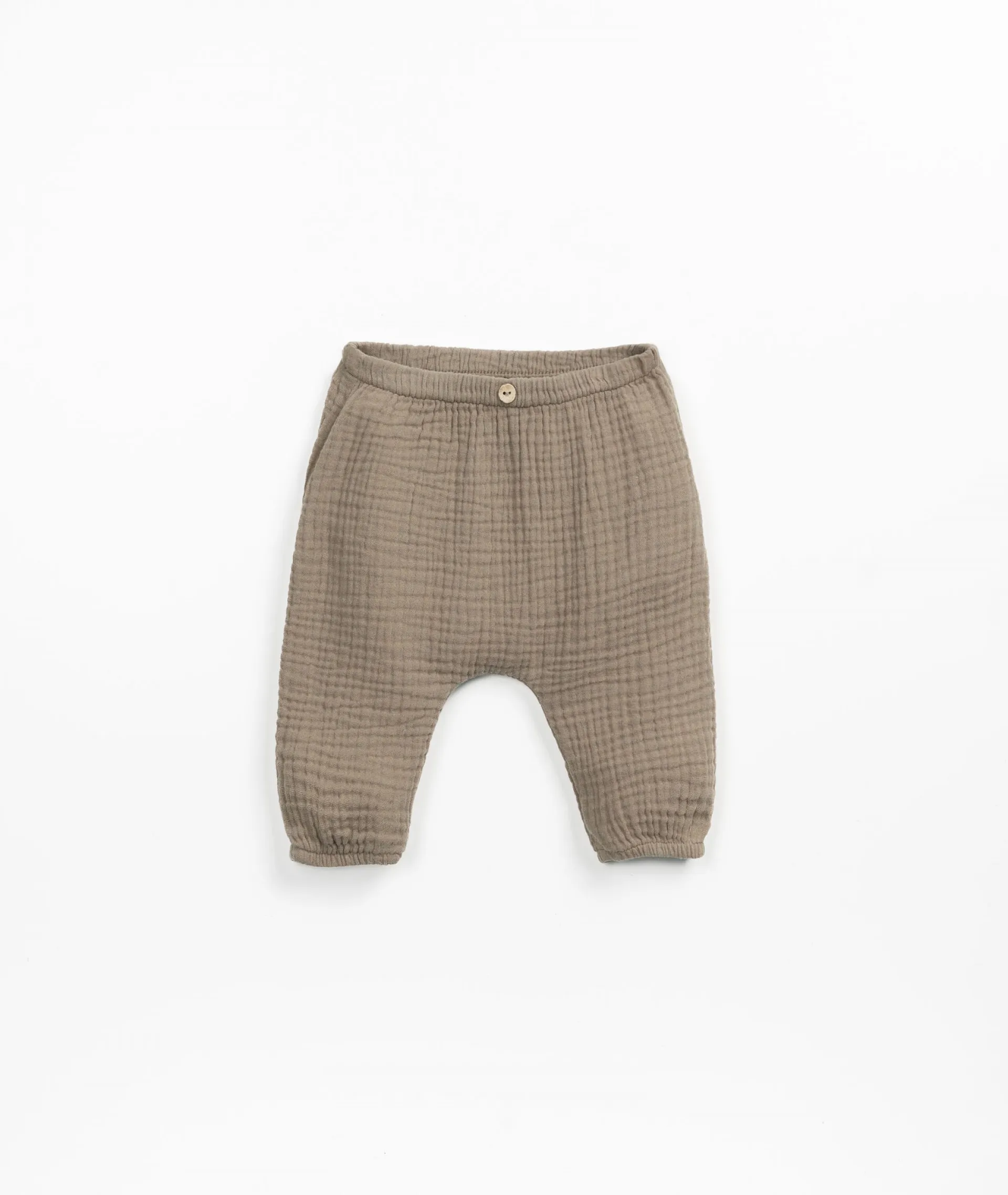 Pantalón de tela con botón de coco de adorno | Textile Art