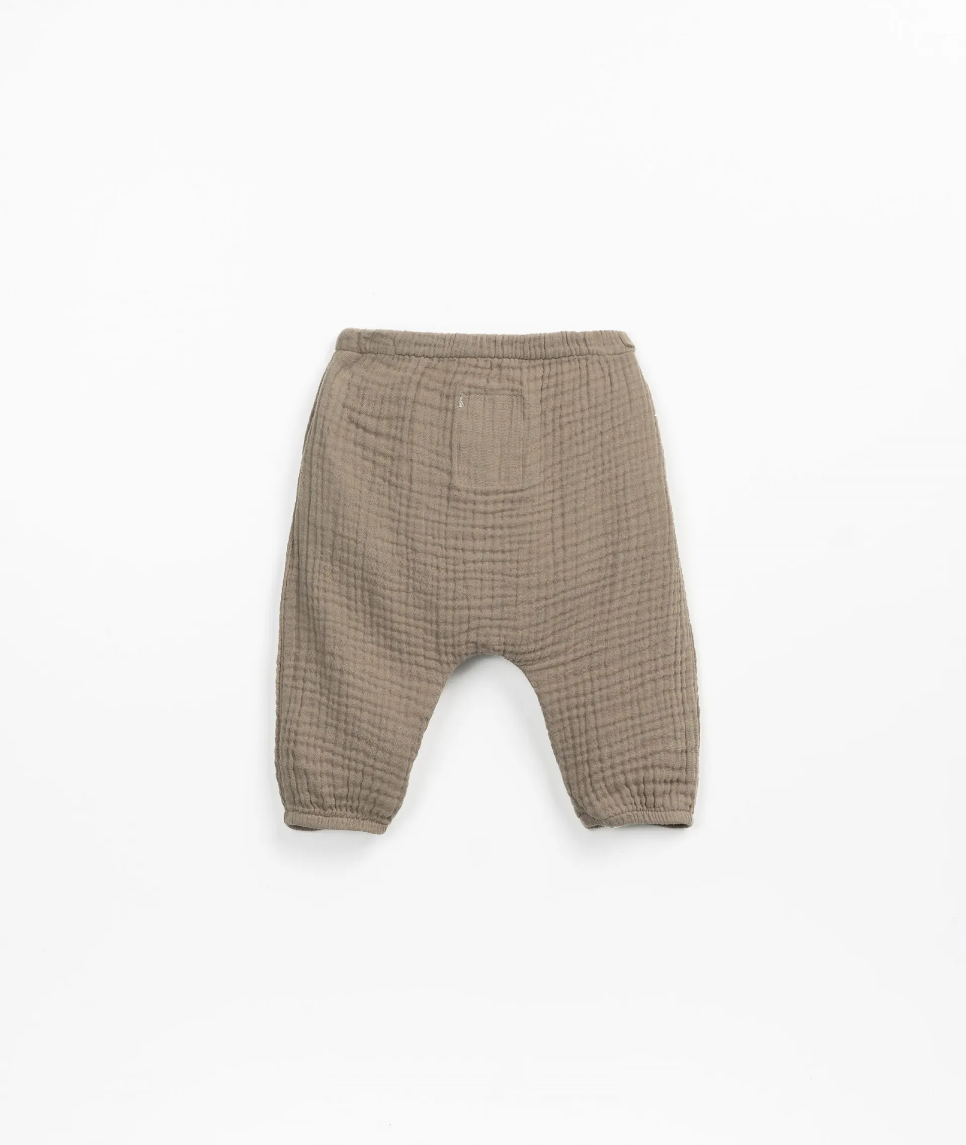 Pantalón de tela con botón de coco de adorno | Textile Art
