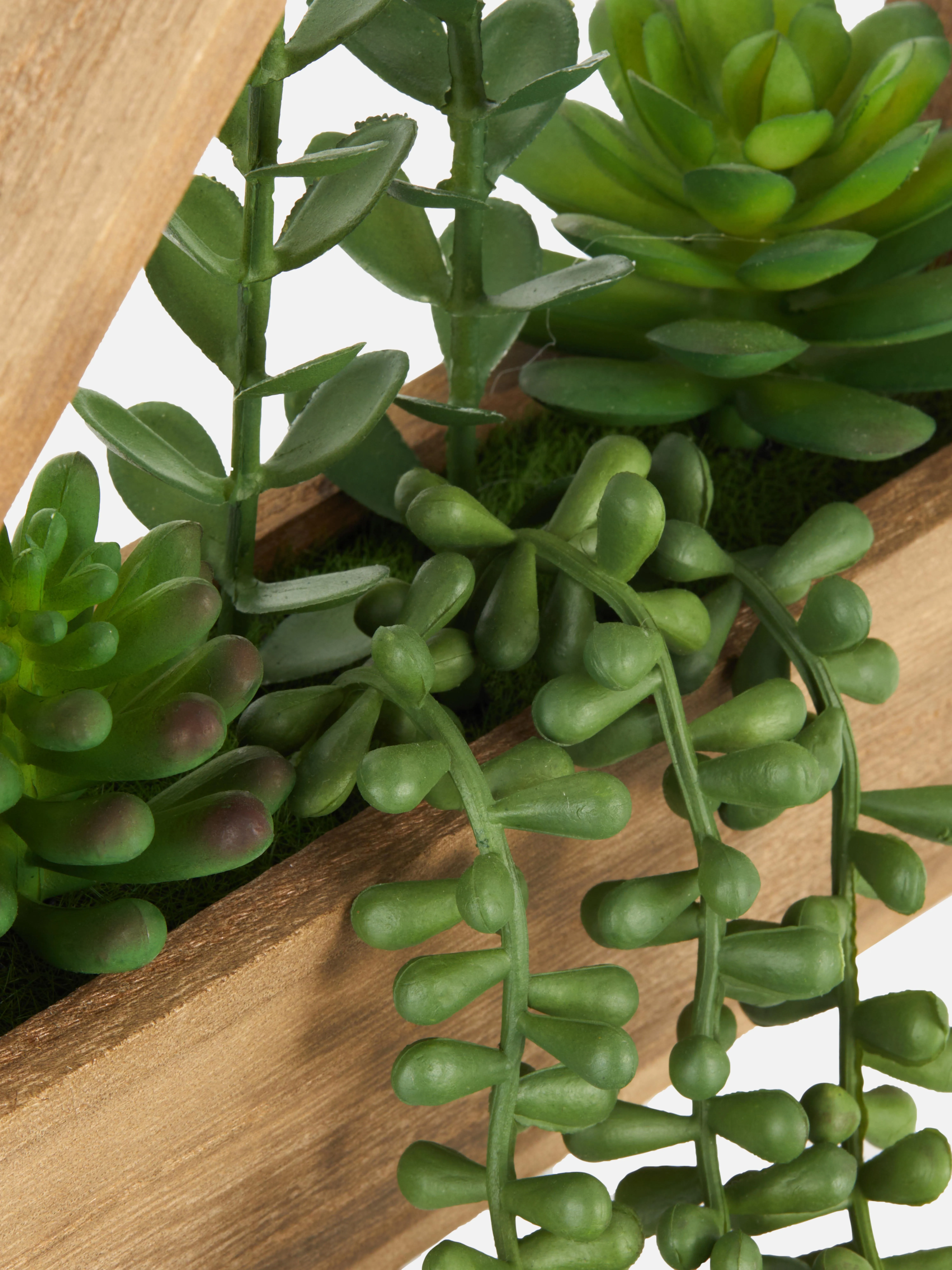 Suculentas artificiales en maceta de madera colgante